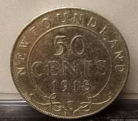 Front side of the 1918 Newfoundland 50 cents coin showing denomination and year.