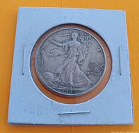 Obverse of 1943 USA half dollar showing Walking Liberty design with visible date and inscription 'IN GOD WE TRUST'.