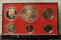 Obverse side of 1979 USA proof coin set showing front faces of Kennedy half dollar, Susan B. Anthony dollar, Washington quarter, Jefferson nickel, Lincoln cent, Roosevelt dime.