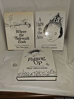 Three hardcover books by Shel Silverstein displayed upright and flat on a white surface showing front covers.