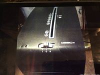 Top view of black Fellowes paper shredder showing control switch and paper entry slot with safety icons.