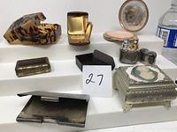 Photo of the lot showing various antique and vintage boxes and containers including metal and decorative boxes, compact, and lighter.