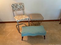 Photo showing set of three seating items: tubular metal chair with floral fabric, teal vinyl padded ottoman, and metal wire base ottoman with tan cushion
