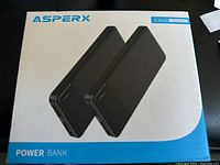 Box front showing two black ASPERX power banks and 2-pack 10000mAh label