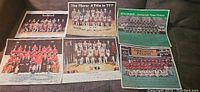 Photo showing six vintage Philadelphia sports team photos including 1974 Eagles, 1976 and 1977 76ers, 1977 Flyers, and 1978 Phillies. Photos include signatures from Sunday Bulletin newspapers.