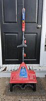 Front view of red WEN electric snow shovel with 12.5-inch wide blade and adjustable handle, in used but good condition.