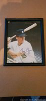 Framed 8x10 autographed photograph of Travis Fryman wearing Detroit Tigers uniform in batting stance.