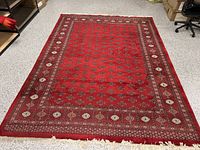 Overall view of full rug laid flat on floor showing entire design and dimensions