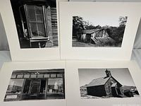 Four mounted 11x14 black and white photography prints of Bodie ghost town and one unknown location shown laid out on white backing.