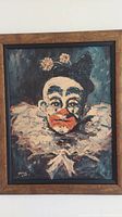 Frontal photo of the framed clown art showing the detailed portrait.