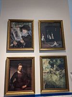 Four framed prints on a wall featuring known classical artworks, showing overall lot condition and frames.