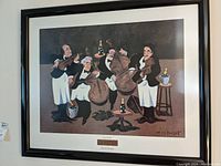 Image of framed wall art 'Guy Buffett Quartet' showing four men in waiters uniform around table with drinks.