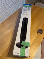 Box of a 37 inch oscillating tower fan, box shows fan image and dimensions.