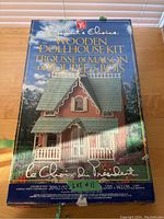 Box of the President's Choice Wooden Dollhouse Kit with image of assembled dollhouse on front.