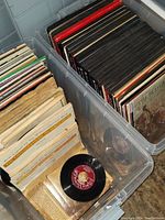 Two plastic bins filled with vintage vinyl LP record albums arranged vertically with album spines visible, including a visible album 'The Budapest Quartet'
