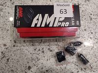 Box with UCLEAR AMP Pro name visible, sealed accessories bags on the side.