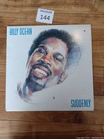 Front cover of the vinyl LP album Suddenly by Billy Ocean, showing a painted portrait of the artist with minor wear visible at corners and surface.