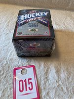 Front view of sealed box showing NHL Hockey 1990-91 High Number Series logo and shrink wrap intact.