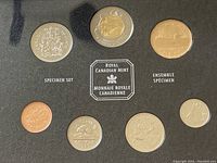 Seven coins in original Royal Canadian Mint specimen set packaging, including the $2 Nunavut commemorative coin.
