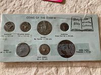 Full set of authentic reproductive coins displayed on card marked with 'Coins of the Bible' and corresponding dates and names.