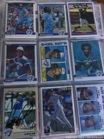 Full view of nine baseball cards in plastic sleeve, showing players including Dave Stieb, Roy Lee Jackson, Jorge Bell, Lloyd Moseby, Luis Leal, Paul Molitor, and Vince Coleman, some with autographs in black and blue ink.