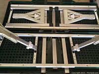 Close-up of the metal frame parts of the portable table and umbrella supports