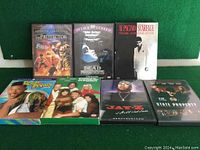 Front view of all 7 DVDs including movie and TV series titles such as The Protector, Dead Presidents, Scarface, The Fresh Prince of Bel-Air, and Three's Company.