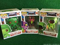 Three boxed Masters of the Universe Funko Pop figures showing front box art and figures inside: He-Man (Slime Pit) #952, Tung Lashor #994, Kobra Khan #41.