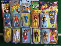 Front view of all 10 action figures in original packaging showing characters and packaging condition