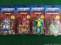 Front view of all four Masters of the Universe action figures in original packaging: Evil-Lyn, Beast Man, Mer-Man, Eternian Goddess.