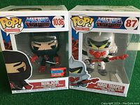 Photo of the two boxed Pop! figures side by side showing character names and edition info.