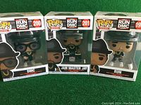 Front view of the three Run DMC Funko Pop! Rocks vinyl figures in box showing DMC, Jam Master Jay, and Run.