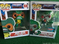 Front view of two Masters of the Universe Funko Pop Retro Toys figures in original boxes, Mer-Man and Snake Face.