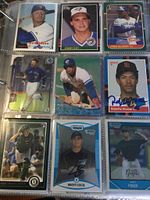 Photo showing nine baseball cards in sleeves laid out in a plastic organizer, featuring Jose Canseco, Jimmy Key, Fred McGriff, Roberto Alomar, Josh Donaldson, Brett Cecil and others.