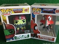 Front view of two boxed Masters of the Universe Pop! Television vinyl figures: Trap Jaw #487 on left and Mosquitor #999 on right.