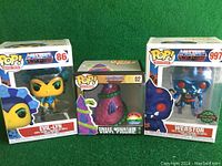 Front view of three Masters of the Universe Funko Pop figures boxed: Evil-Lyn #86, Snake Mountain #02, and Webstor #997.