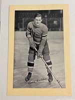 Front view of the vintage hockey photo showing Cecil Dillon in New York Rangers uniform on ice with printed signature.