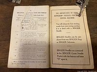 Open instruction booklet showing sewing needle and thread size guide, with text about importance of using Singer needles for best results.