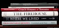 Stacked spines of six books focused on houses, coach houses, and firehouses showing titles and authors.