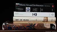 A stack of six books on Islamic art and architecture showing the titles clearly on the spines, giving an overview of the lot's contents.