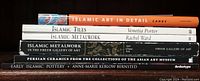 Stack of seven books related to Islamic art, metalwork, ceramics, and tiles.