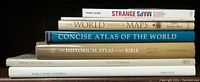 Side view of book spines showing titles and authors of six atlases and map-related books stacked horizontally.
