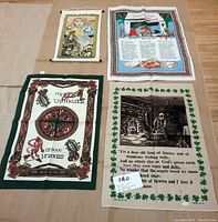 View of all four Irish-themed tea towels laid flat showing different designs including Celtic motifs, artwork, and text.