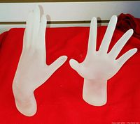 Two frosted plastic hand-shaped ring holders, one large and one small, for displaying rings or bracelets.