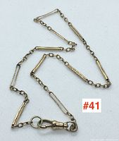 Full length of pocket watch chain with alternating bar and oval links, T-bar and swivel hook visible