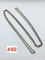 Full view of chain laid flat on white background