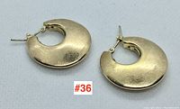 Pair of gold hoop earrings front view