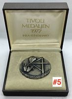 Medallion inside original presentation box with inscriptions on lid.