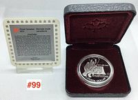1997 Canadian Mint silver proof dollar coin in original case with certificate of authenticity, front view.