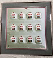 Full view of the framed sheet containing 12 pairs of Year of the Pig stamps in different color variations and designs, mounted on decorative background with text.